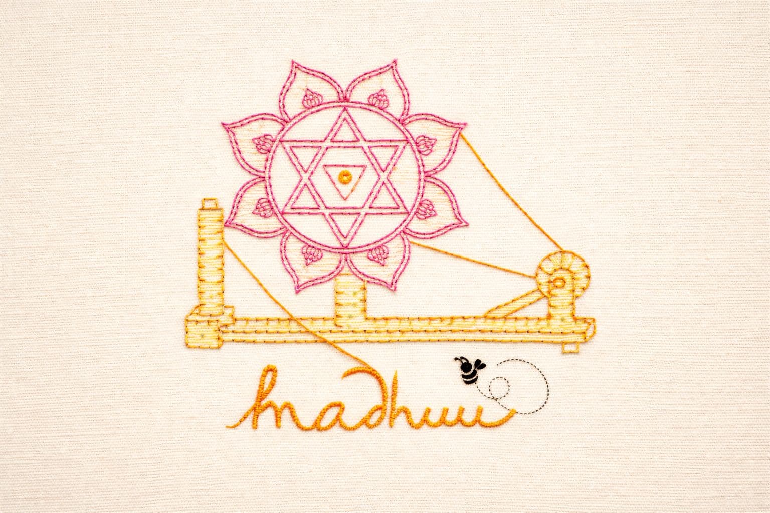 Hand-embroidered Madhuu charkha artwork